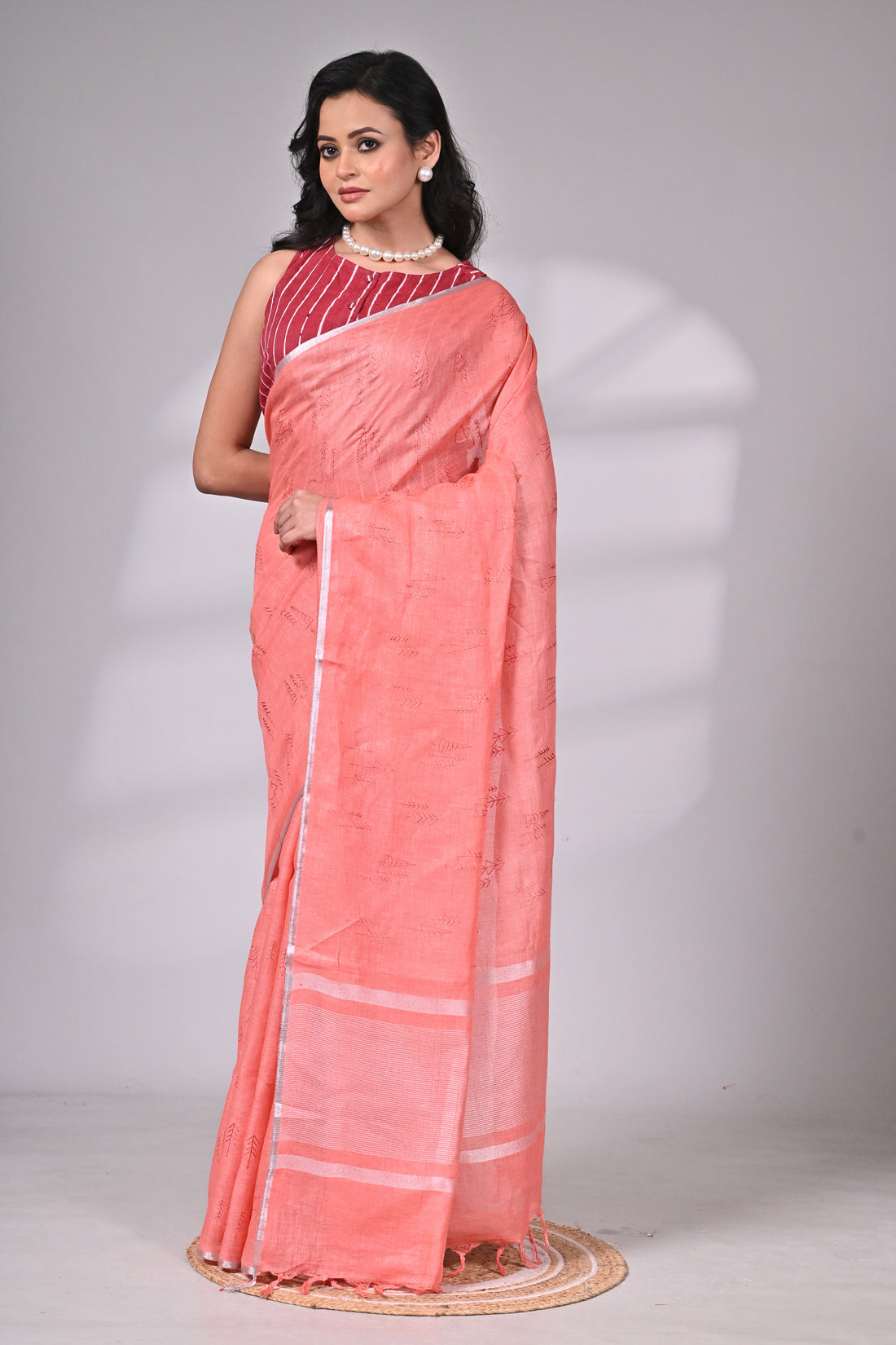 Coral Linen Saree with Subtle Embroidery